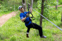 Young Adult Male On Zipline Young Adult Male On Zipline