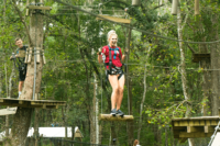 Guest Moving Through Forest Run Course