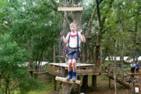 Guest Moving Through Forest Run Course