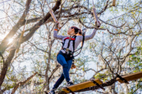 Woman Moving Through Forest Run Course