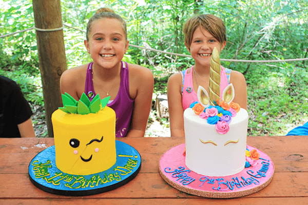 Two Children With Birthday Cakes