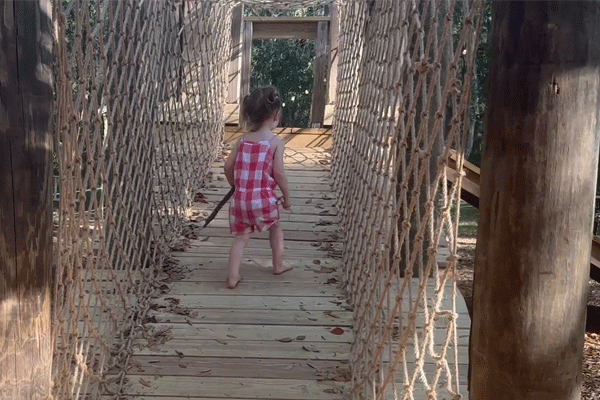 Wooden Bridge WIth Young Child On It