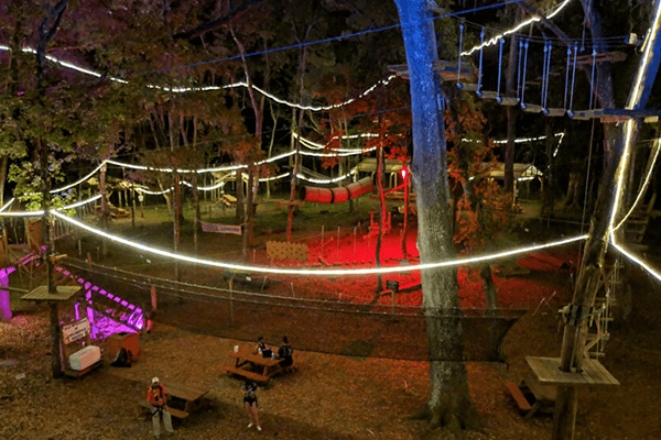 Wide Shot of Courses Lit Up At Night